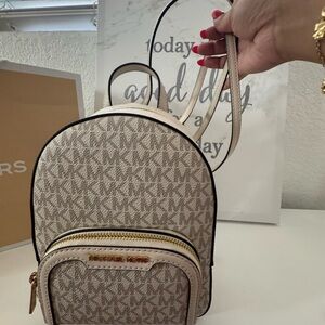 Michael Kors Cream and Gray Monogram Back pack. Brand new with tags.